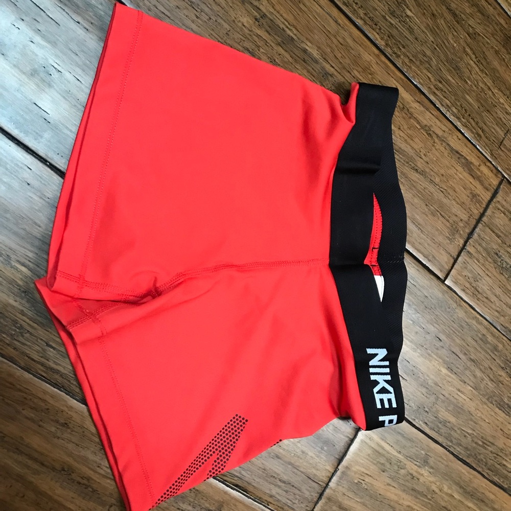 Red Nike shorts